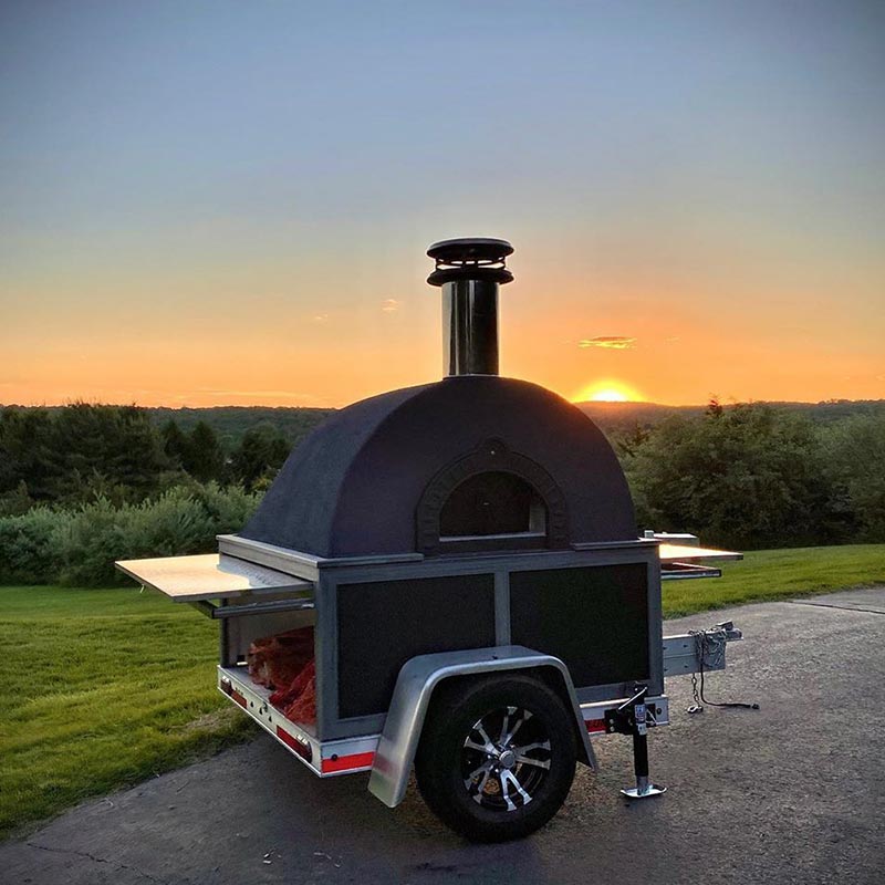 mobile pizza oven at sunset