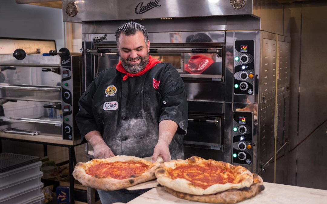 Domenico Tolomeo baking pizza at the Fiero workshop kitchen